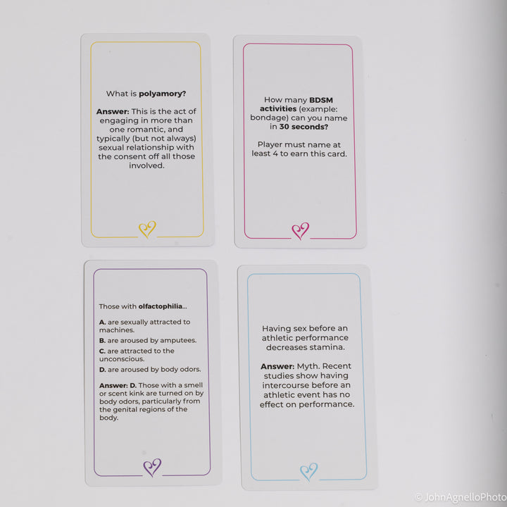 Four rectangular educational cards with rounded corners arranged in a 2x2 grid on a light gray background. Each card has a different colored border and a small heart icon near the bottom.
